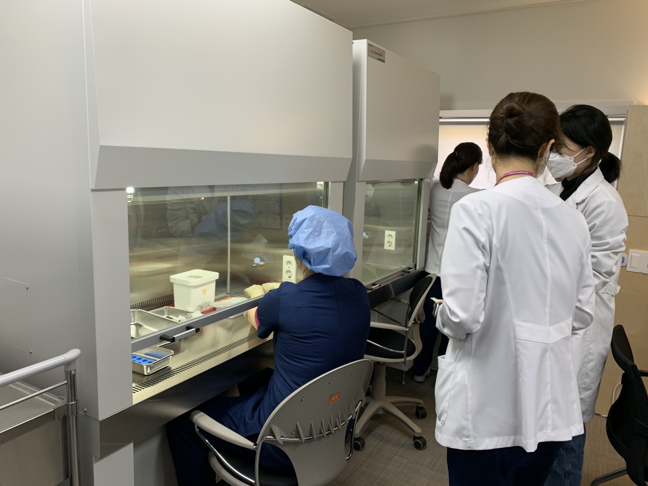Scientists at the National Medical Center prepare Pfizer vaccines for administration Saturday morning. (Kim Arin/The Korea Herald)