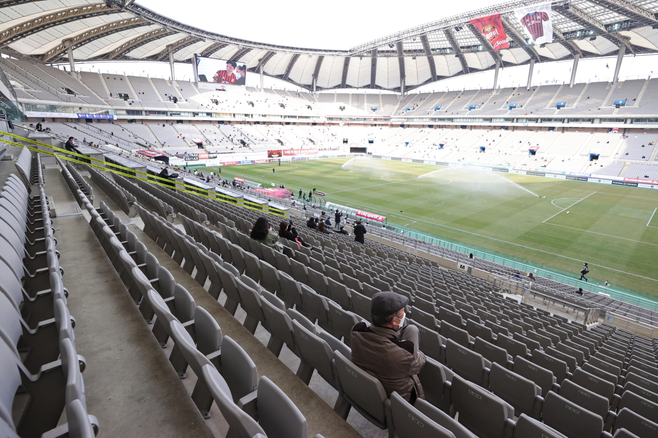 Seoul football stadium accommodates socially distanced spectators on a March weekend. (Yonhap)