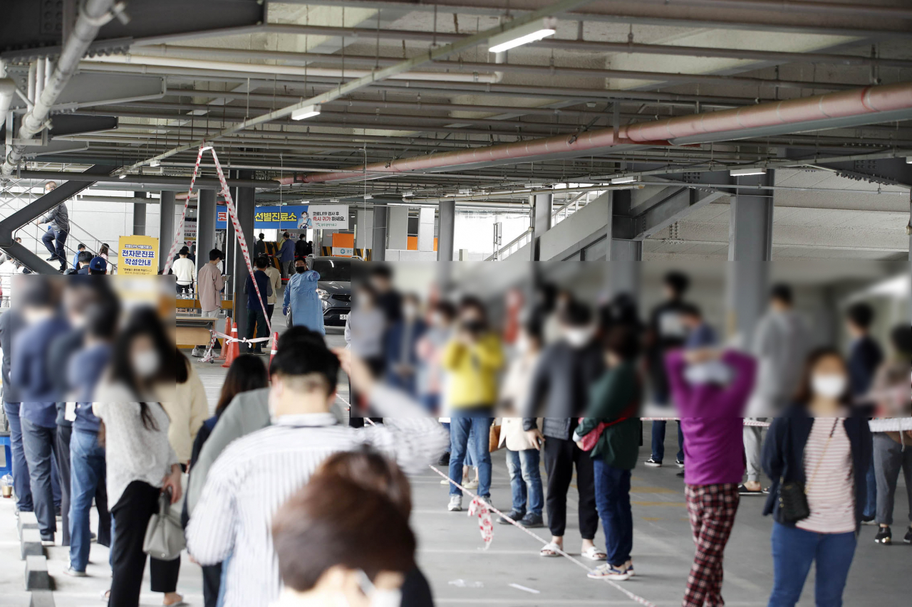 22일 오전 광주 북구 선별진료소에서 관내 대학에서 확진자가 나오면서 검사 대상자들이 몰리고 있다. 연합뉴스