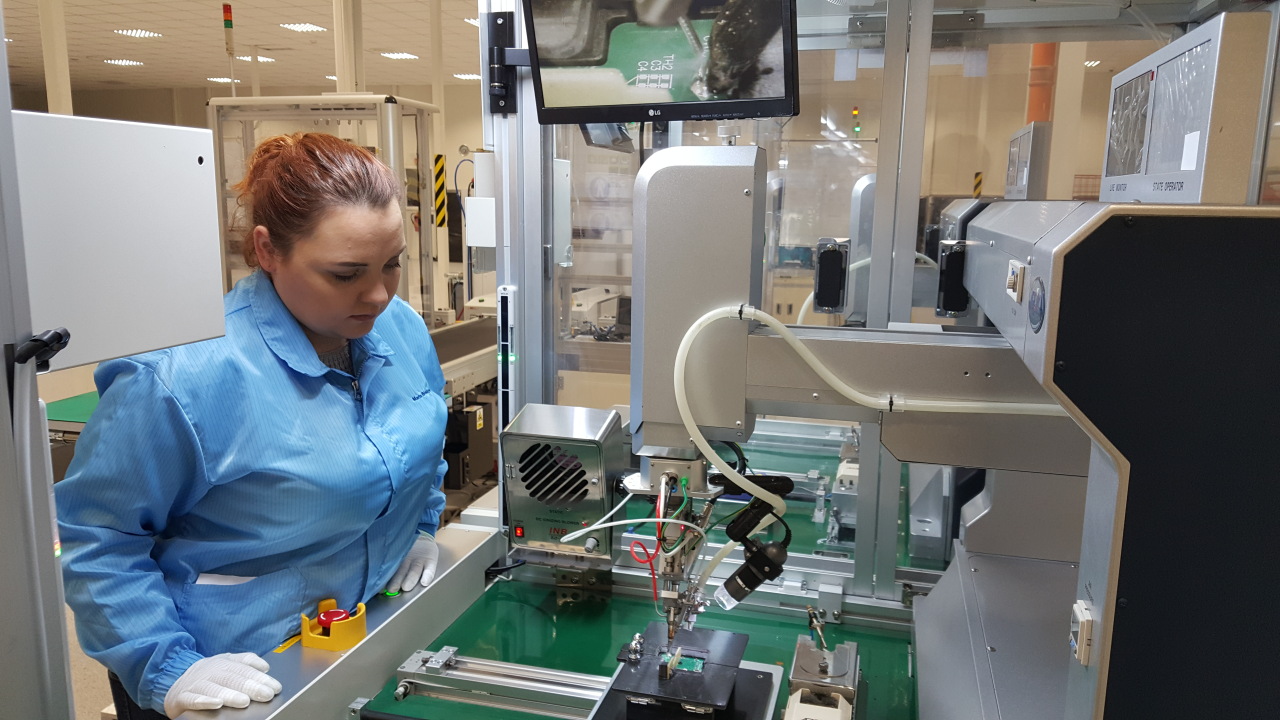 An LS Cable & System official checks an EV component at the company’s business site in Poland. (LS Group)