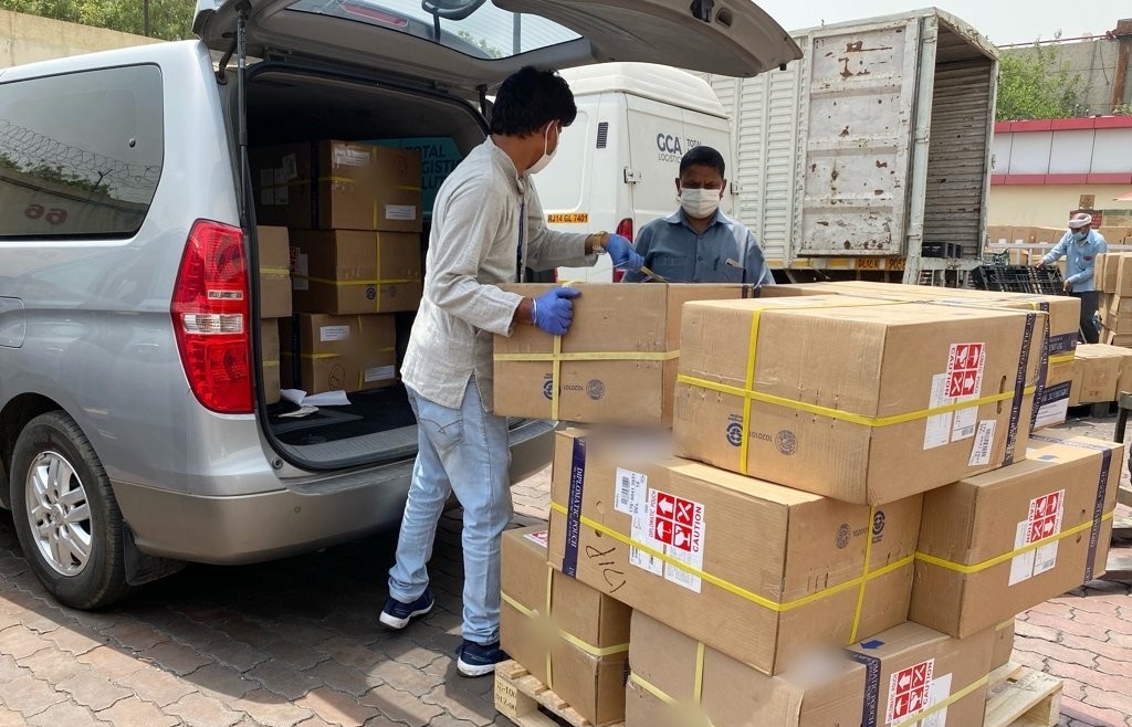 This photo, provided by the South Korean Embassy in India, shows workers moving 14 medical oxygen generators from South Korea that arrived in New Delhi on April 30, 2021, via a diplomatic pouch. (Yonhap)