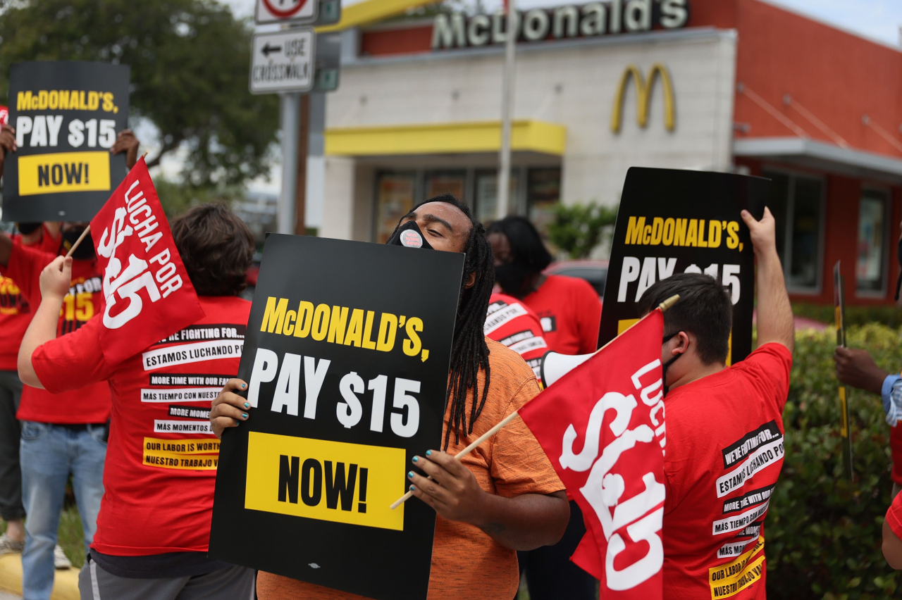 FORT LAUDERDALE, FLORIDA - MAY 19: Michael Howson joins with McDonald's workers and labor activists to protest against the restaurant chain on May 19, 2021 in Fort Lauderdale, Florida. McDonald's workers in 15 cities across the country held the protests on the day before the company's annual shareholder meeting to demand McDonald's pay at least $15/hr. Joe Raedle/Getty Images/AFP == FOR NEWSPAPERS, INTERNET, TELCOS & TELEVISION USE ONLY ==