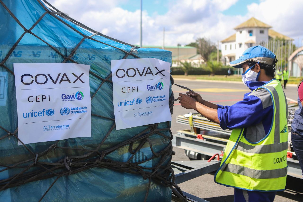 A worker handles boxes of AstraZeneca COVID-19 vaccines, part of the COVAX program, which aims to ensure equitable access to COVID-19 vaccinations. (AFP-Yonhap)