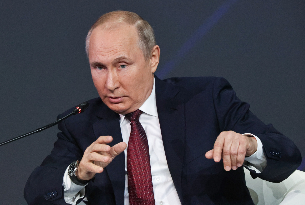 Russian President Vladimir Putin gestures as he speaks at the St. Petersburg International Economic Forum in St. Petersburg, Russia, Friday. (AP-Yonhap)