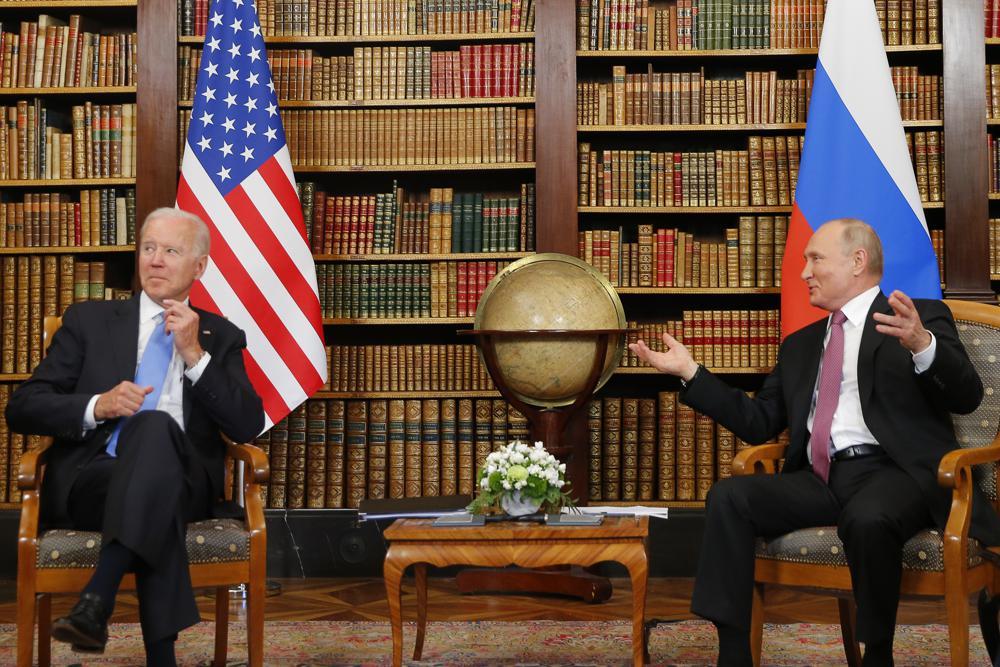 US President Joe Biden, left, and Russia's President Vladimir Putin, right, meet for the US-Russia summit at Villa La Grange in Geneva, Switzerland, Wednesday. (AP)
