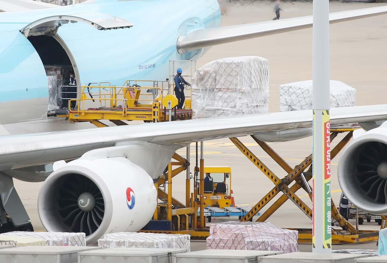 Boxes containing COVID-19 vaccines from Moderna are unloaded at a cargo terminal inside the Incheon International Airport on Sunday. (Yonhap)
