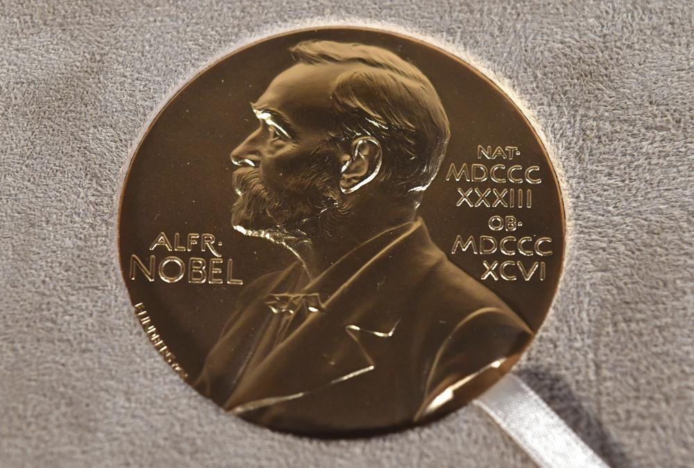 A Tuesday, Dec. 8, 2020 file photo of a Nobel medal displayed during a ceremony in New York. The Nobel Prize in Literature is due to be awarded on Thursday Oct. 7, 2021. (Angela Weiss/Pool Photo via AP, File)