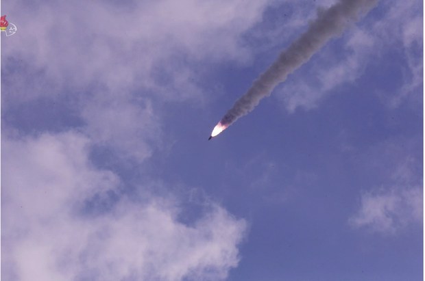 this photo captured from North Korea's Korean Central TV Broadcasting Station on Wednesday a new type of a submarine-launched ballistic missile (SLBM) is test-fired from waters the previous day. The South Korean military said North Korea fired what appears to be an SLBM toward the East Sea from waters off Sinpo, a city on the North's east coast. (Yonhap)