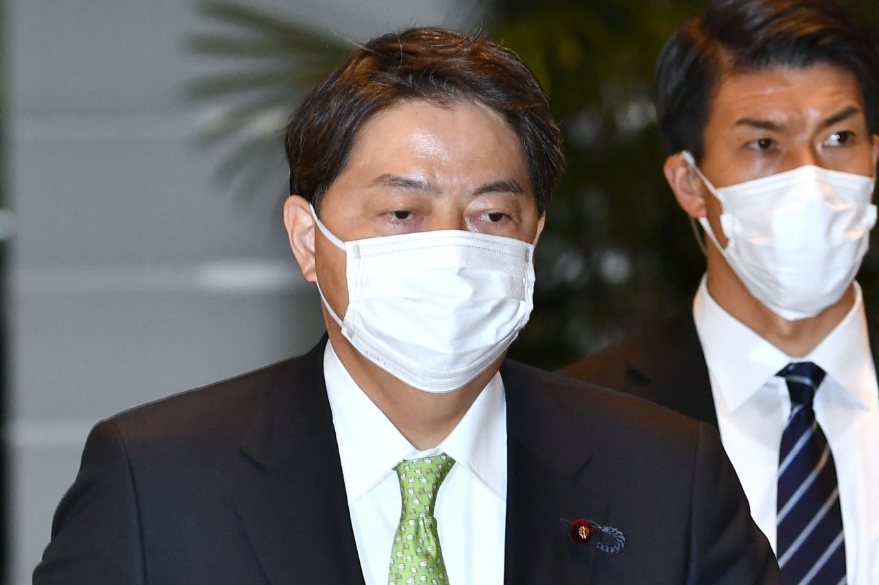 Yoshimasa Hayashi (left), Japan's new foreign minister, arrives at the prime minister's office in Tokyo on Wednesday. (AFP-Yonhap)