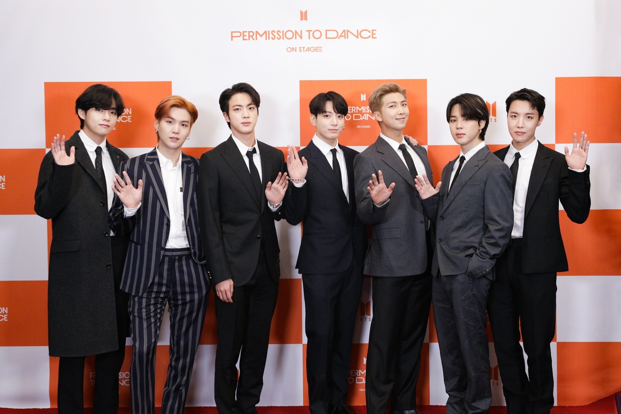 BTS members – From left: V, Suga, Jin, Jungkook, RM, Jimin and J-Hope pose for pictures at the global conference conducted Sunday at SoFi Stadium in Los Angeles. (BigHit Music)