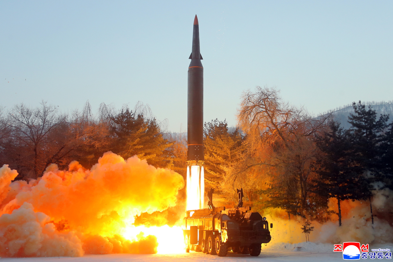 This photo, released by North Korea's official Korean Central News Agency on Jan. 6, 2022, shows what the North claims to be a new hypersonic missile being launched the previous day. (Yonhap)