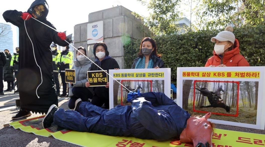 A group of animal rights activists holds a protest in front of KBS TV headquarters in Seoul on Jan. 21, 2022, following revelations that a horse used during filming of the TV series "The King of Tears, Lee Bang-won" died due to apparent abuse. (Yonhap)