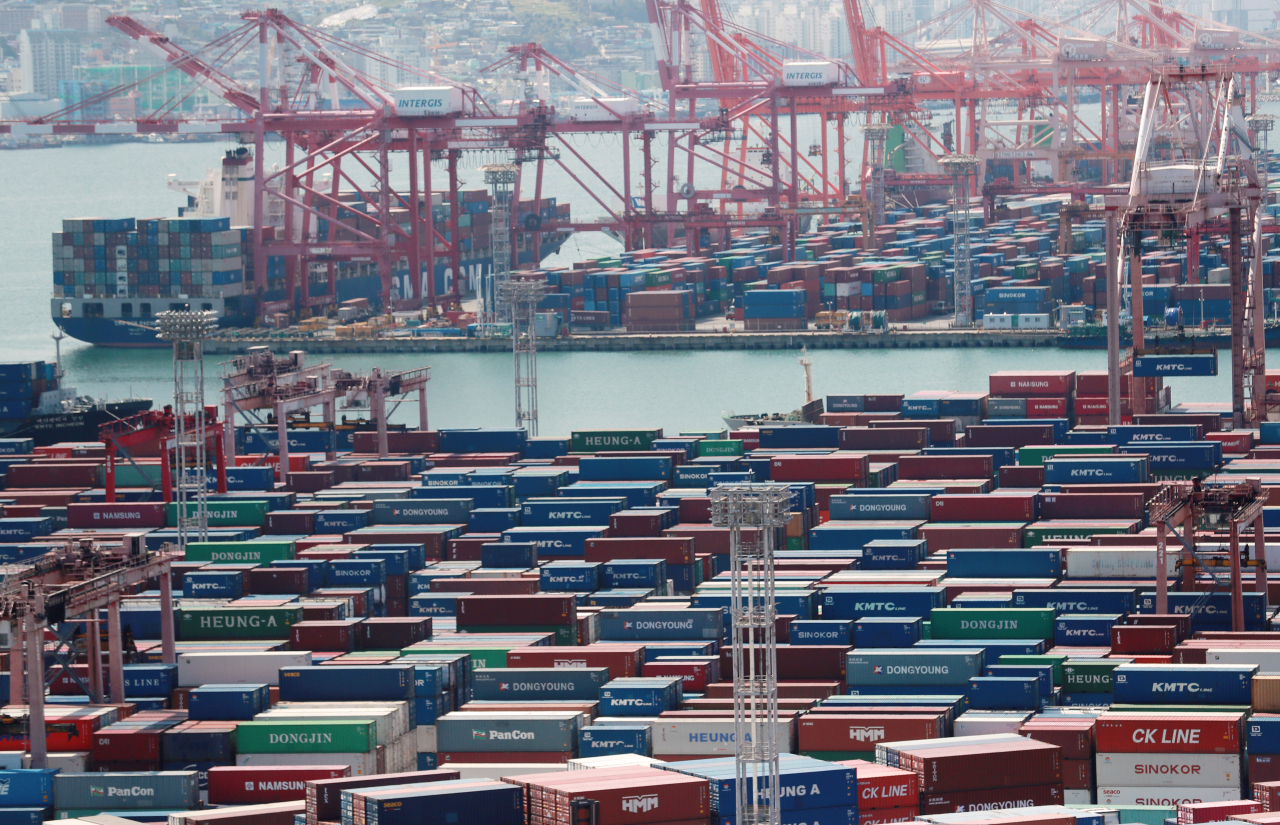 The file photo shows cargo ships anchored at Busan Port. (Yonhap)