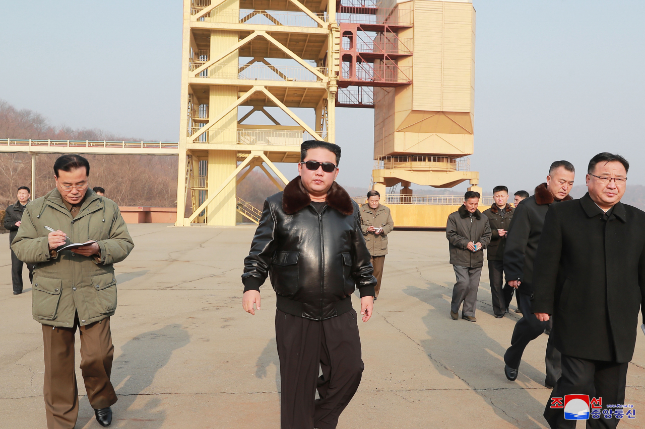 North Korean leader Kim Jong-un (C) visits the Sohae Satellite Launching Ground in Cholsan, North Pyongan Province, in this undated photo released on Friday, by the North's official Korean Central News Agency. Kim's visit to the satellite test site on the west coast came as Seoul and Washington jointly concluded Pyongyang's recent purported "reconnaissance satellite" development tests were those of a new intercontinental ballistic missile system. (KCNA)