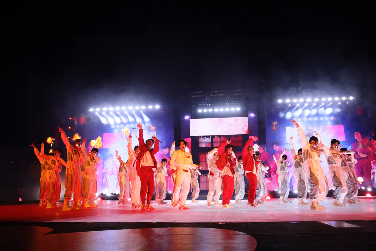 This photo provided by Big Hit Music shows K-pop supergroup BTS performing during one of its three concerts at Seoul Olympic Stadium on March 10, 12-13, 2022. (Big Hit Music)