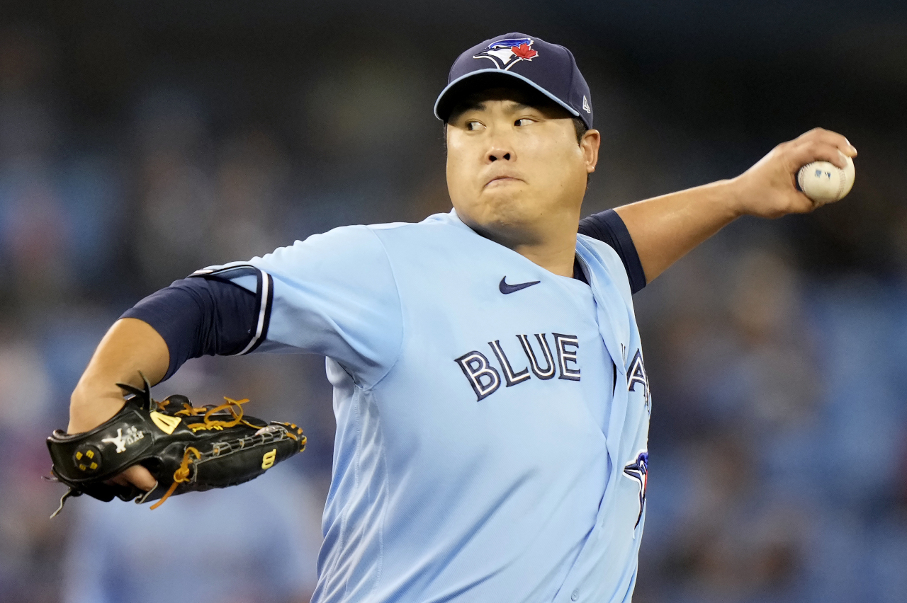 In this Canadian Press photo via Associated Press, Ryu Hyun-jin of the Toronto Blue Jays pitches against the Baltimore Orioles in the top of the first inning of a Major League Baseball regular season game at Rogers Centre in Toronto on Sunday. (AP-Yonhap)