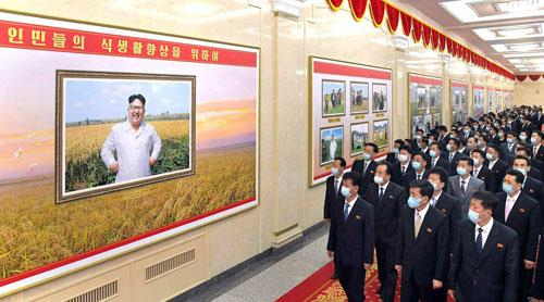 This photo captured from the website of the North's main newspaper Rodong Sinmun on Monday, shows a photo exhibition in Pyongyang marking a decade of leader Kim Jong-un's rule. (Yonhap)