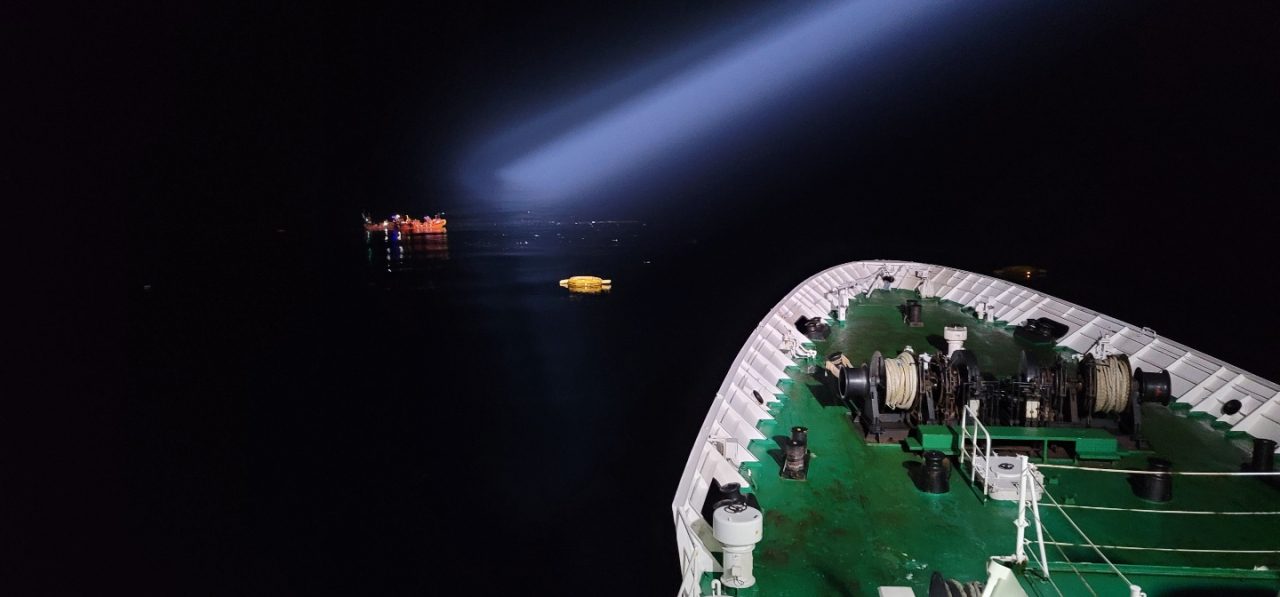 A search operation off Mara Island is under way on Friday, in this photo provided by the Coast Guard. (Coast Guard)