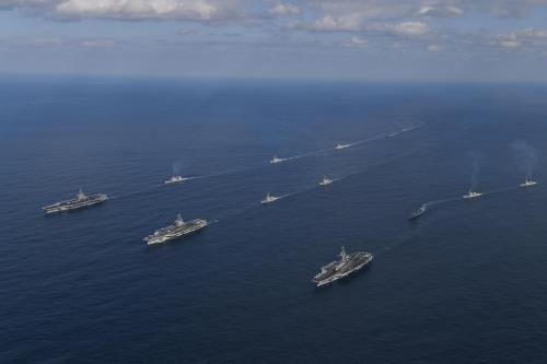 This photo, provided by South Korea's Navy on Nov. 12, 2017, shows three US aircraft carriers steaming in the East Sea, leading South Korean and US warships during the allies' joint naval exercise. (South Korea's Navy)