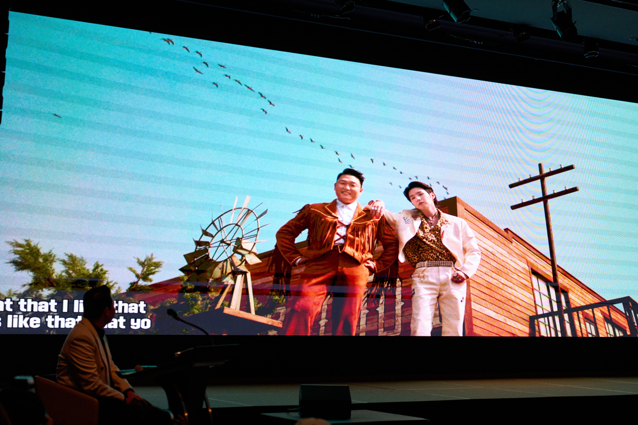 The music video of “That That” plays during a “Psy 9th” press listening session in Seoul on April 29. (P Nation)