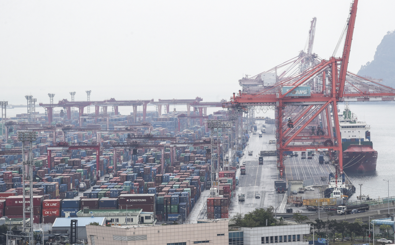 This file photo, taken April 21, 2022, shows stacks of containers at a port in South Korea's southeastern city of Busan. (Yonhap)