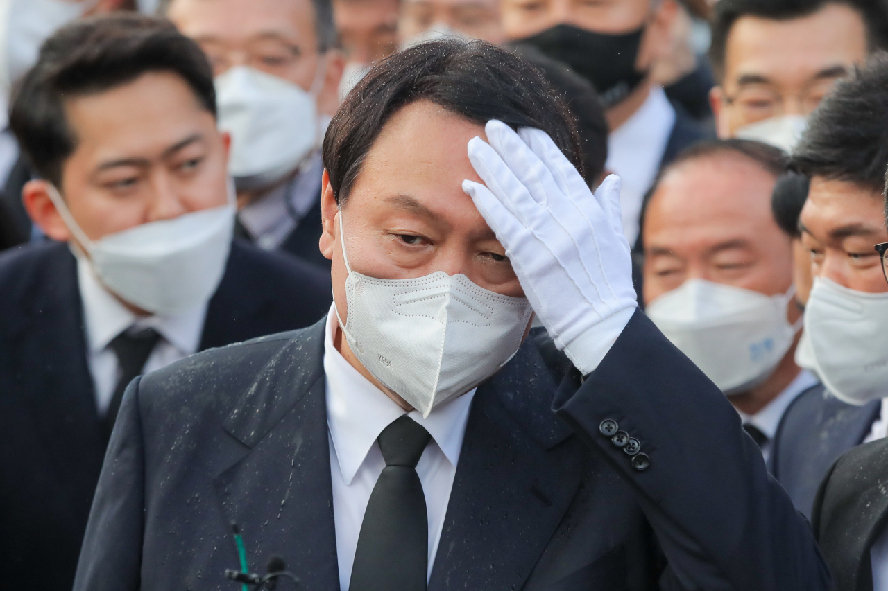Yoon Seok-youl, People Power Party's presidental candidate, speaks to reporters during his visit to the May 18th National Cemetery in Gwangju on Nov.10. (Yonhap)