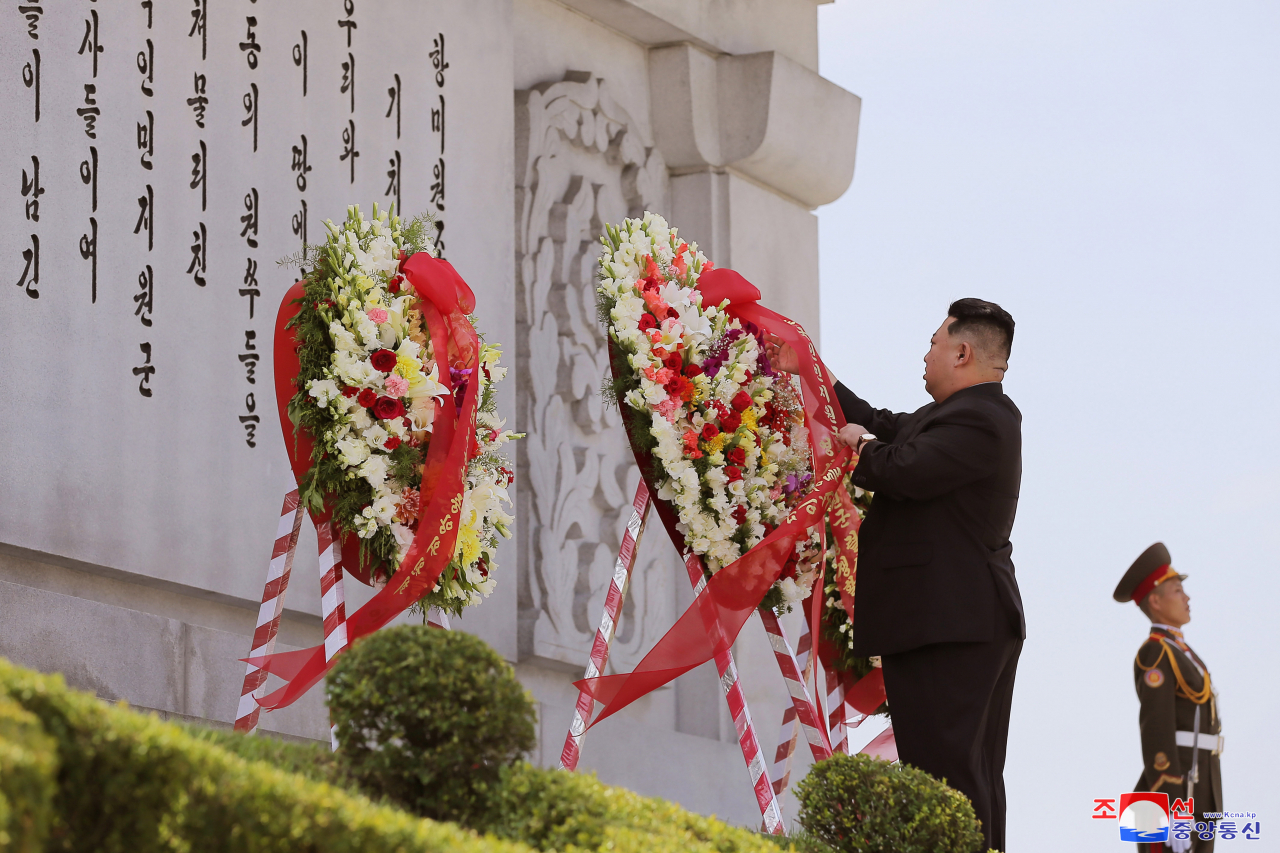 North Korea's leader Kim Jong-un places a wreath at the Friendship Tower in Pyongyang on Thursday, to mark the 69th anniversary of the Korean War armistice that fell on the previous day, in this photo released by the North's official Korean Central News Agency. The tower commemorates Chinese soldiers who died while fighting for the North in the 1950-53 Korean War. North Korea refers to the three-year conflict as the Great Fatherland Liberation War and designates the date of the armistice signing as Victory Day. (KCNA)