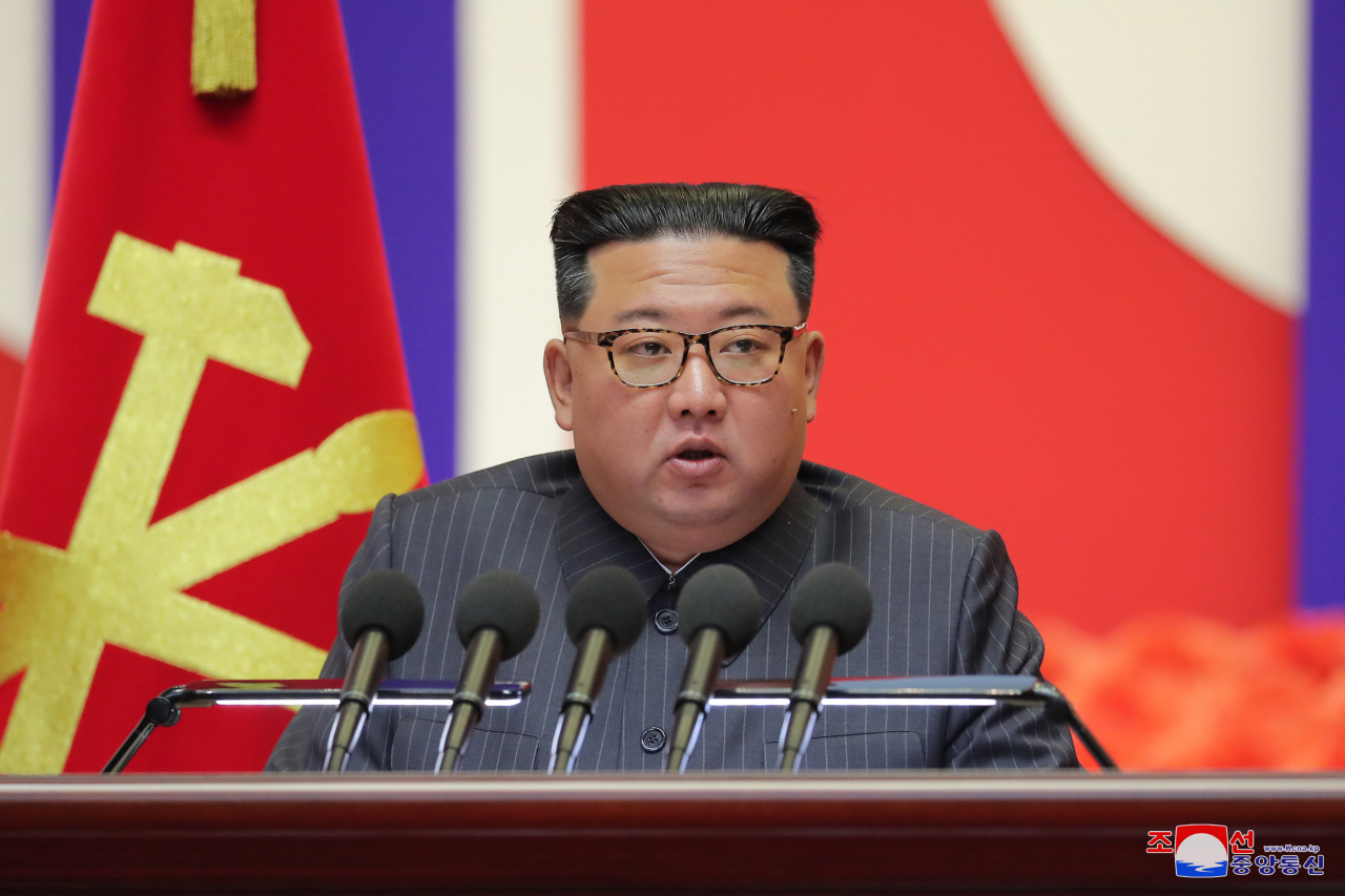 This photo, released by the North's official Korean Central News Agency on Thursday, shows North Korean leader Kim Jong-un making a speech to declare victory in the country's fight against COVID-19 during a national meeting on anti-epidemic measures in Pyongyang held the previous day. (KCNA)