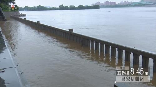 Water in the Dadong River in Pyongyang overflows in this image captured from the North's Korean Central Television on Aug. 7. (North's Korean Central Television)