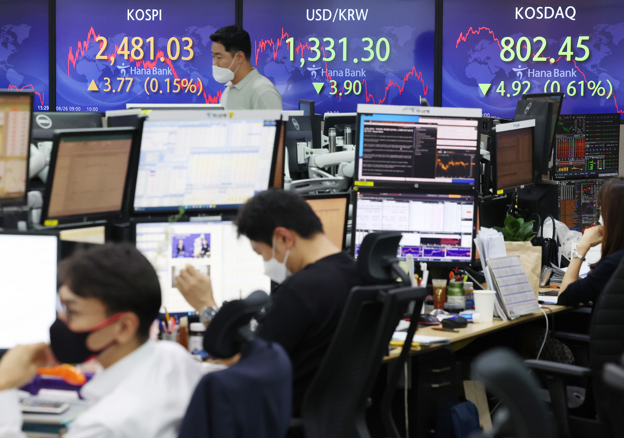 This photo, taken on Friday, shows stock and currency movements depicted at an electronic signboard at a Hana Bank dealing room in Seoul. (Yonhap)