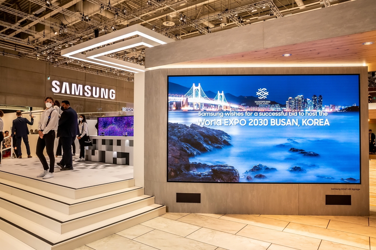 This photo, provided by Samsung Electronics Co. on Monday, shows its booth with a screen airing promotional footage for South Korea's bid to host the 2030 World Expo in Busan, at the IFA consumer electronics show in Berlin, Germany from Friday to Tuesday.(Yonhap)