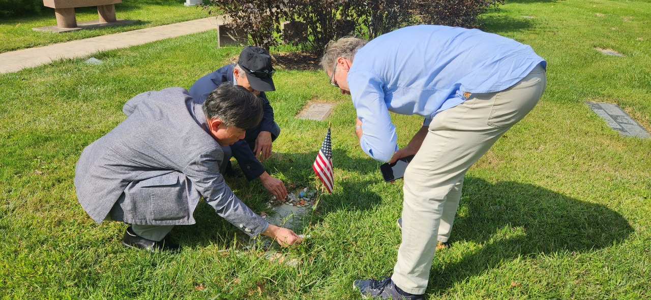Lee and Ha visited the cemetery where the 22-year-old American student was laid to rest. (courtesy of Lee)