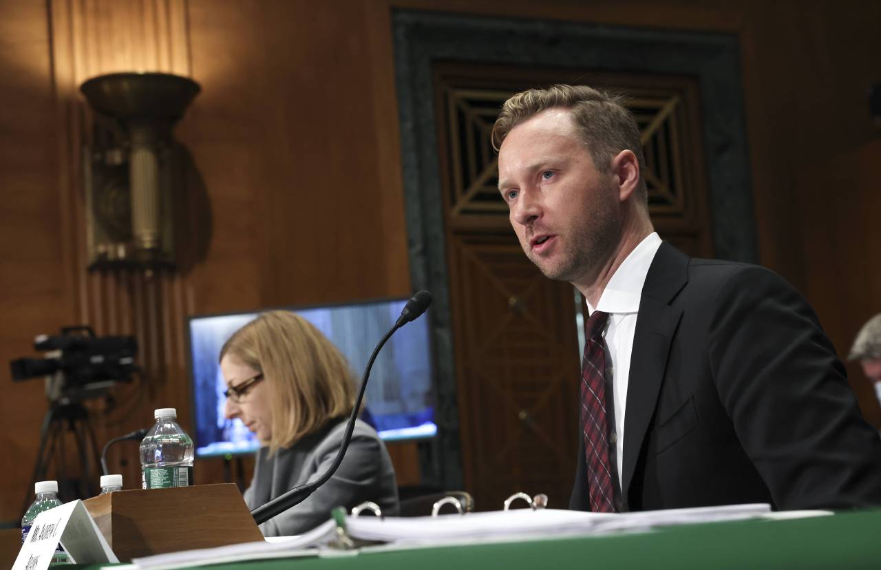 Andrew Adams (R), Director, Task Force KleptoCapture at the US Department of Justice, and Elizabeth Rosenberg, Assistant Secretary For Terrorist Financing And Financial Crimes at the US Department of Treasury, testify before the Senate Banking, Housing, and Urban Affairs Committee on Russian sanctions, on Capitol Hill, September 20, 2022 in Washington, DC. The Committee held the hearing to discuss additional sanctions against Russia for its invasion of Ukraine. (Kevin Dietsch/ AFP via Getty Images)