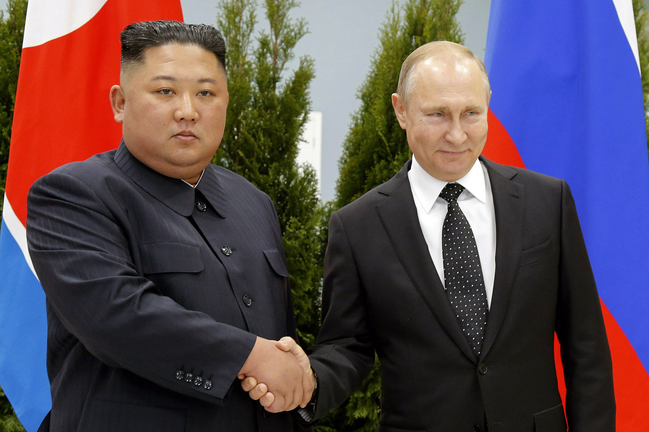 Russian President Vladimir Putin, right, and North Korea's leader Kim Jong-un shake hands during their meeting in Vladivostok, Russia, April 25, 2019. North Korea says it has not exported any weapons to Russia during the war in Ukraine and has no plans to do so, and said U.S. intelligence reports of weapons transfers were an attempt to tarnish North Korea's image. (FILE PHOTO - AP)