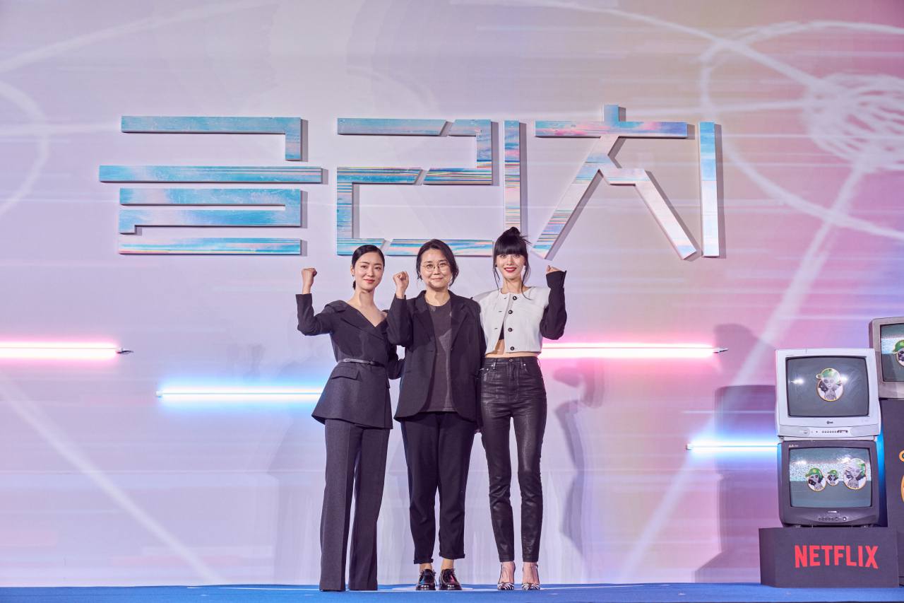 From left: Jeon Yeo-been, director Roh Deok and Nana pose for photos before a press conference at Yongsan CGV in Yongsan, central Seoul, Tuesday. (Netflix)