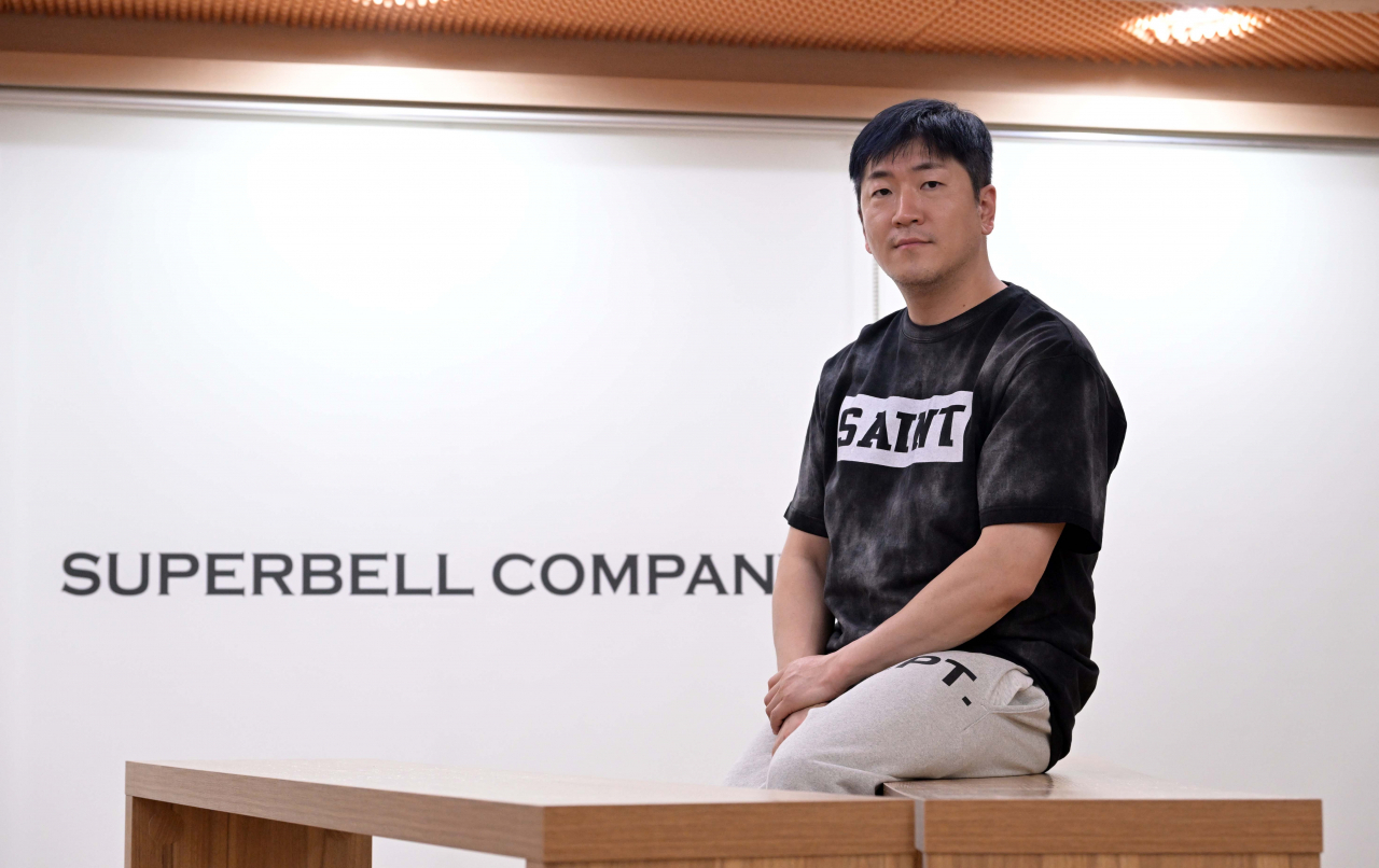 Veteran K-pop producer Ryan Jhun poses for a photo during a recent interview with The Korea Herald at Superbell Company‘s headquarters in Mapo-gu, western Seoul. (Lee Sang-sub/The Korea Herald)