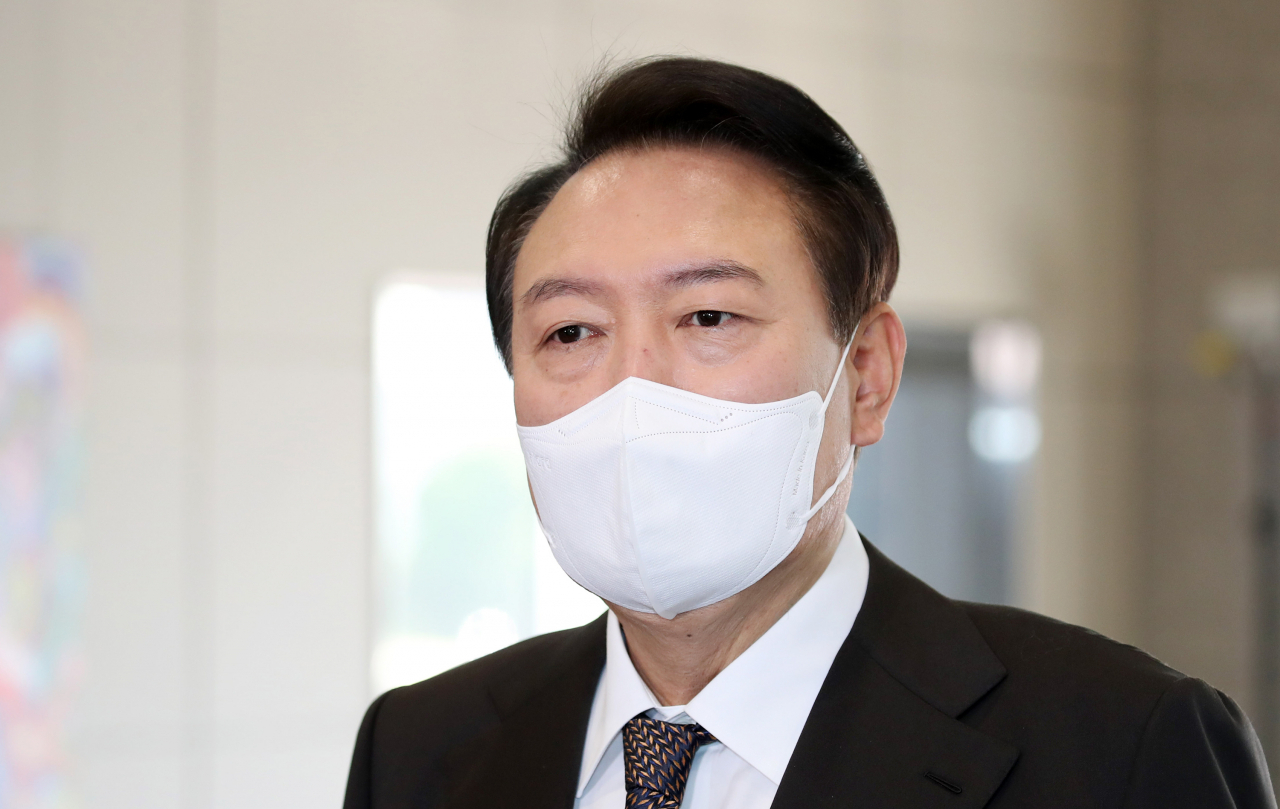 President Yoon Suk-yeol speaks to reporters as he arrives at the presidential office in Seoul on Tuesday. (Yonhap)
