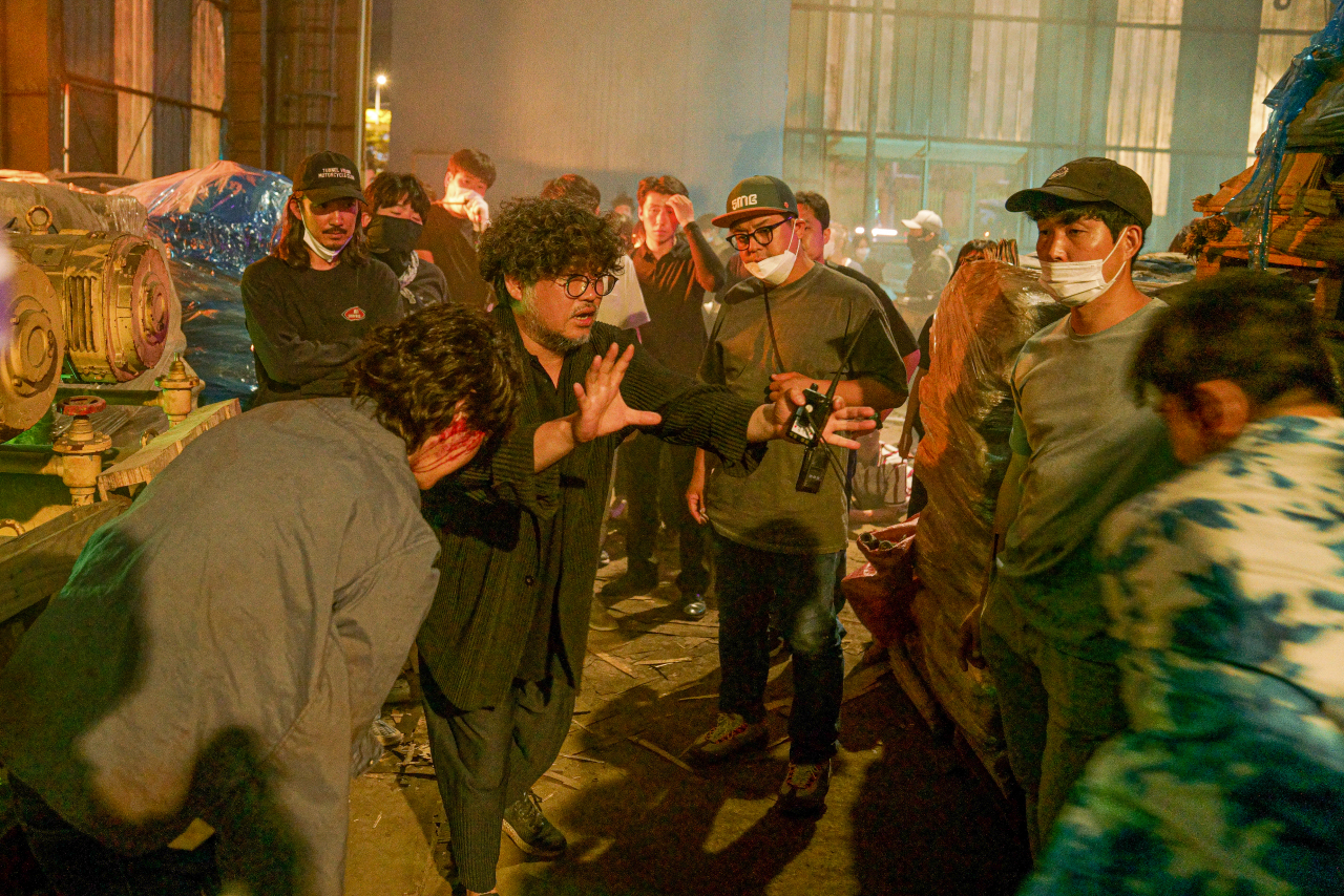 Director Kim Hong-sun (center) on the set of “Project Wolf Hunting” (TCO)