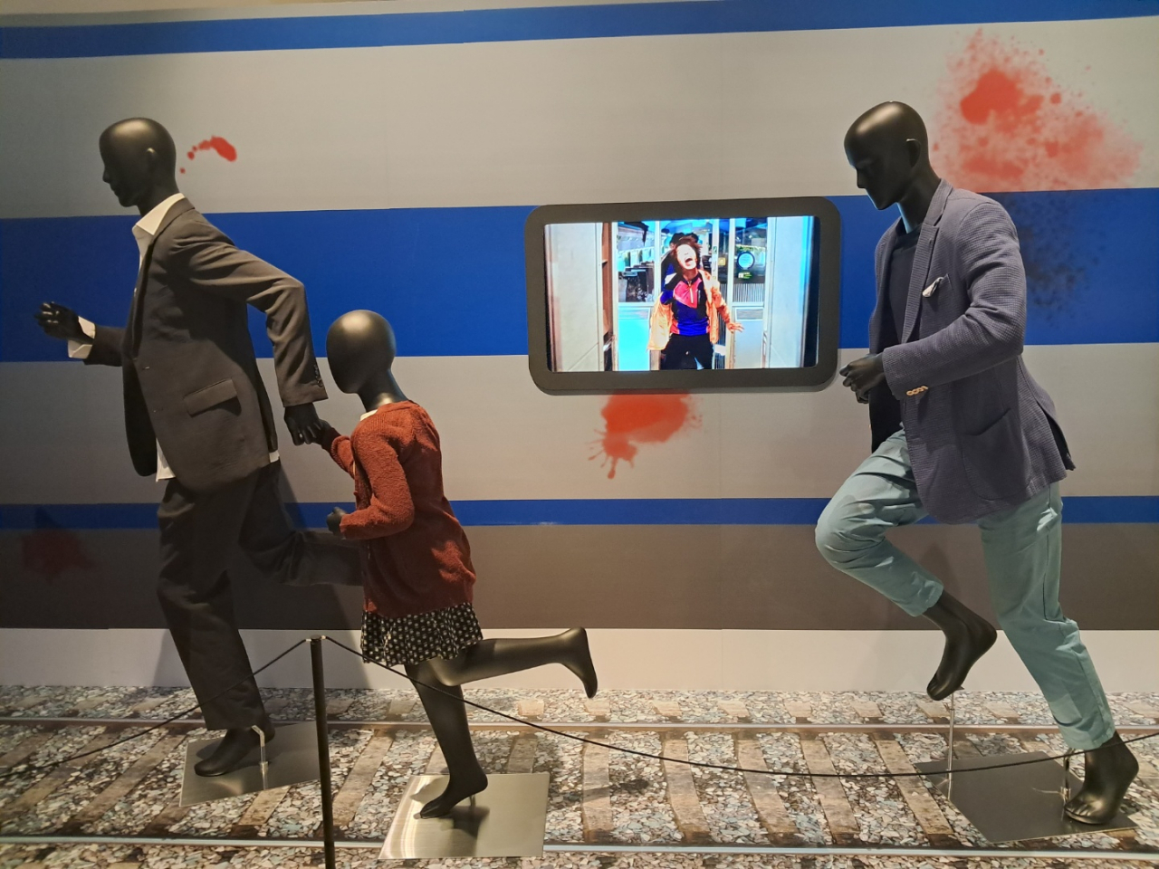 Costumes worn by the actors in “Train to Busan” are on display at ““All of Us are (Not) Zombies: 21st Century K-Zombie Chronicle.” (Lee Si-jin/The Korea Herald)