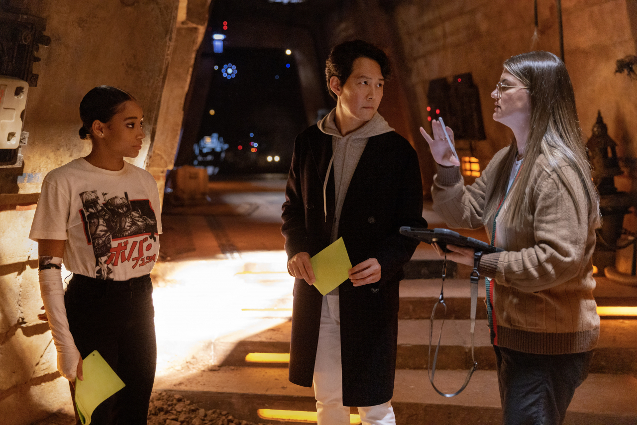 From left: Actors Amandla Stenberg, Lee Jung-jae and director Leslye Headland on the set of "The Acolyte" (Lucasfilm, Walt Disney Co. Korea)