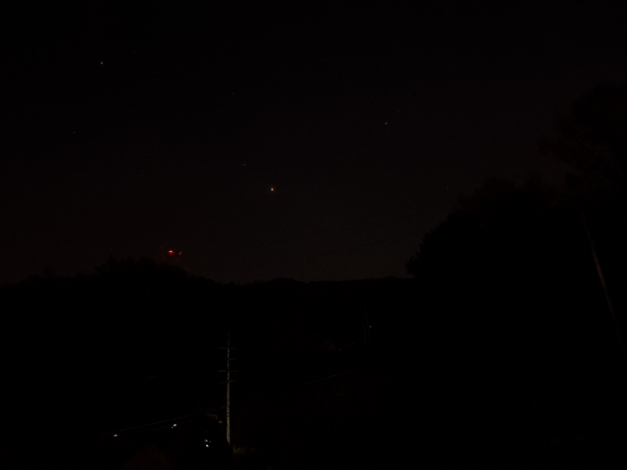 Mars is observed as a small orange dot on the night of Nov. 16. (Lee Si-jin/The Korea Herald)