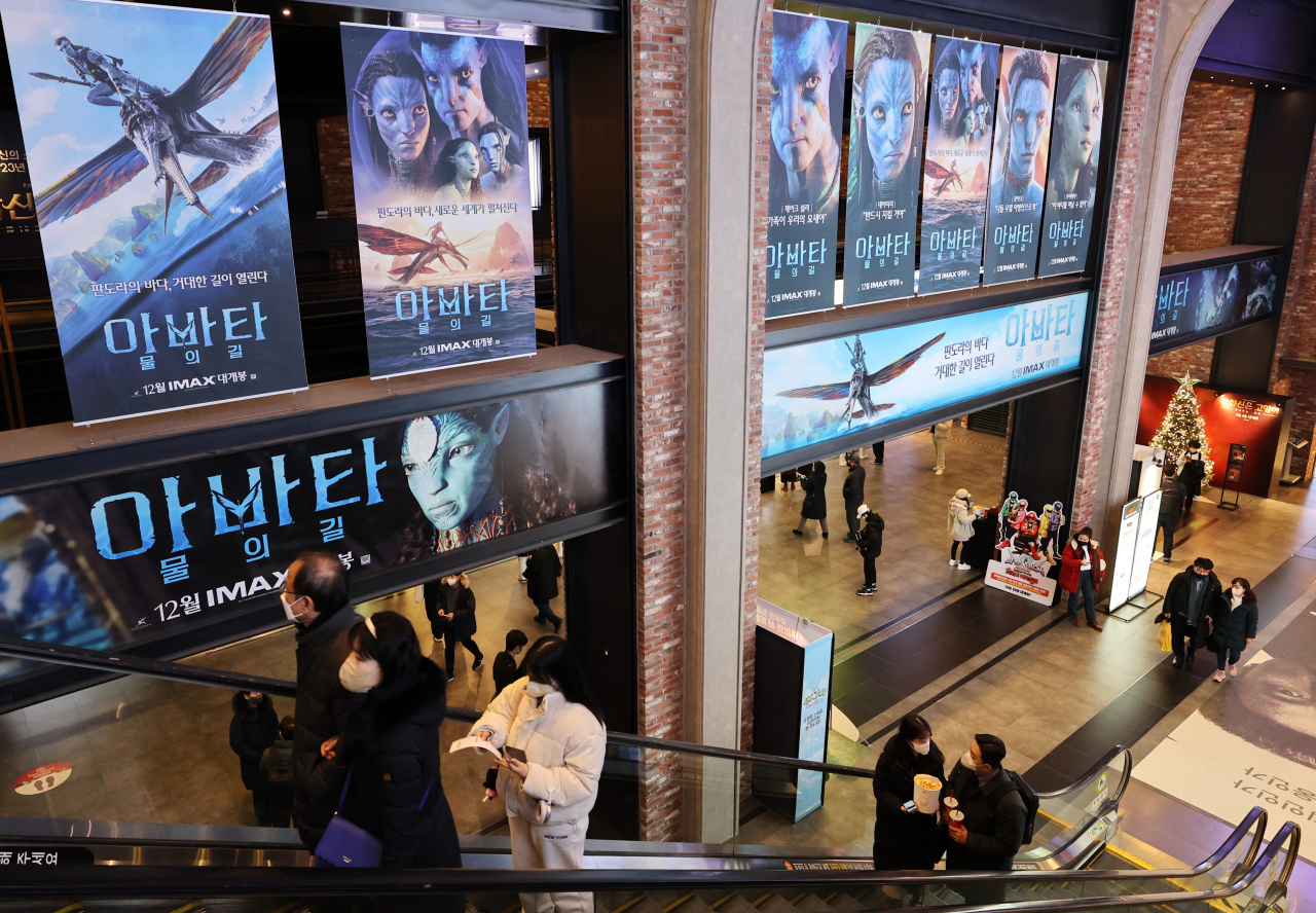 Posters of "Avatar: The Way of Water" are hung up on the wall of a theater in Seoul on Tuesday. (Yonhap)
