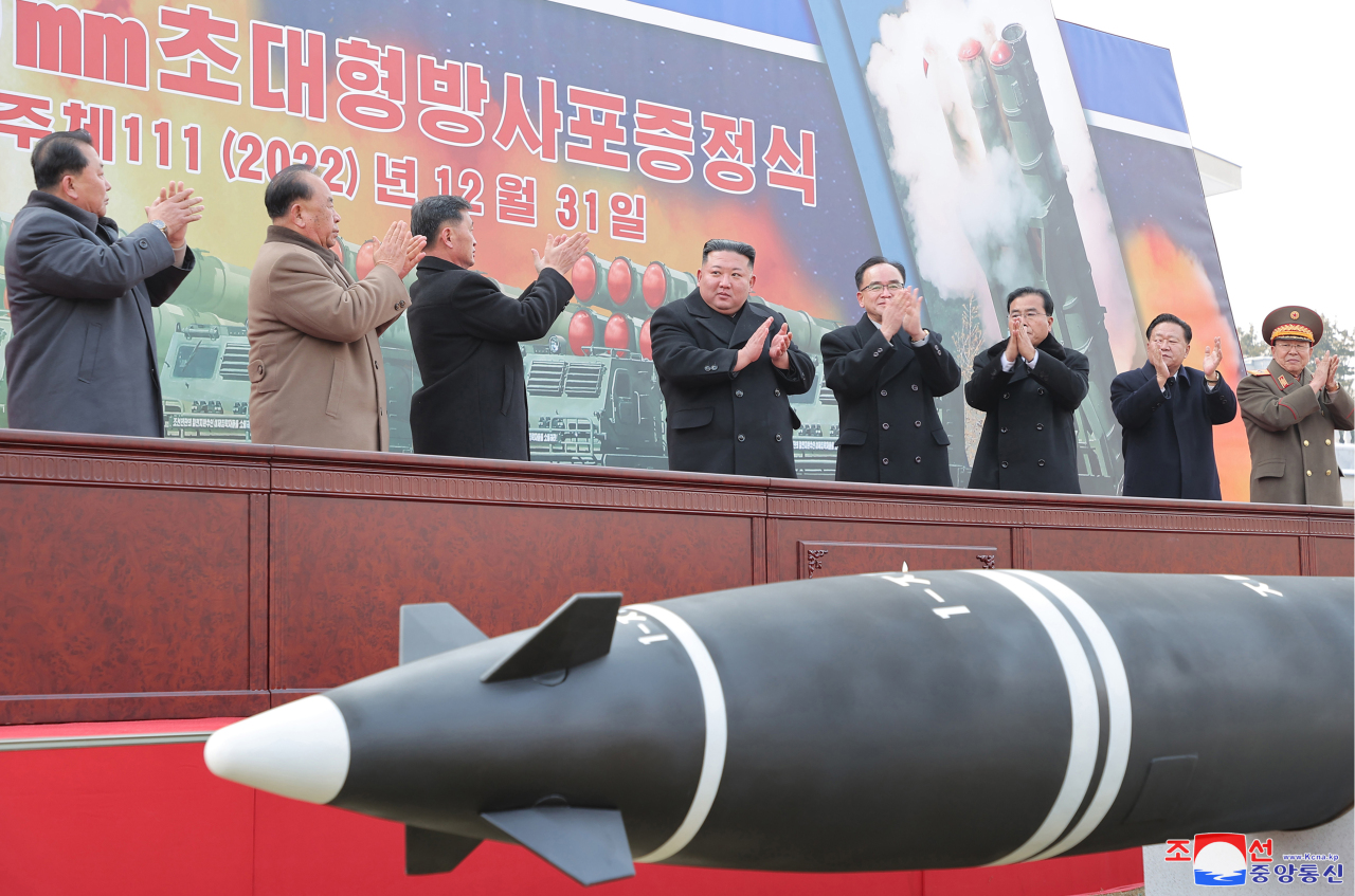 This photo, carried by North Korea's official Korean Central News Agency on Jan. 1, 2023, shows North Korean leader Kim Jong-un speaking at a plenary meeting of the ruling Workers' Party of Korea, raising the need to exponentially increase the number of its nuclear arsenal. (Yonhap)