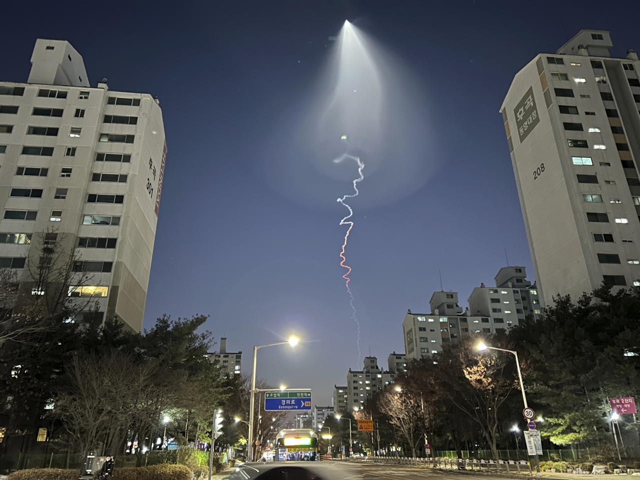 The light trail is seen in Goyang, South Korea, Friday, Dec. 30, 2022. South Korea's military confirmed it test-fired a solid-fueled rocket on Friday, after its unannounced launch triggered brief public scare of a suspected UFO appearance or a North Korean missile or drone flying. (Photo - AP)