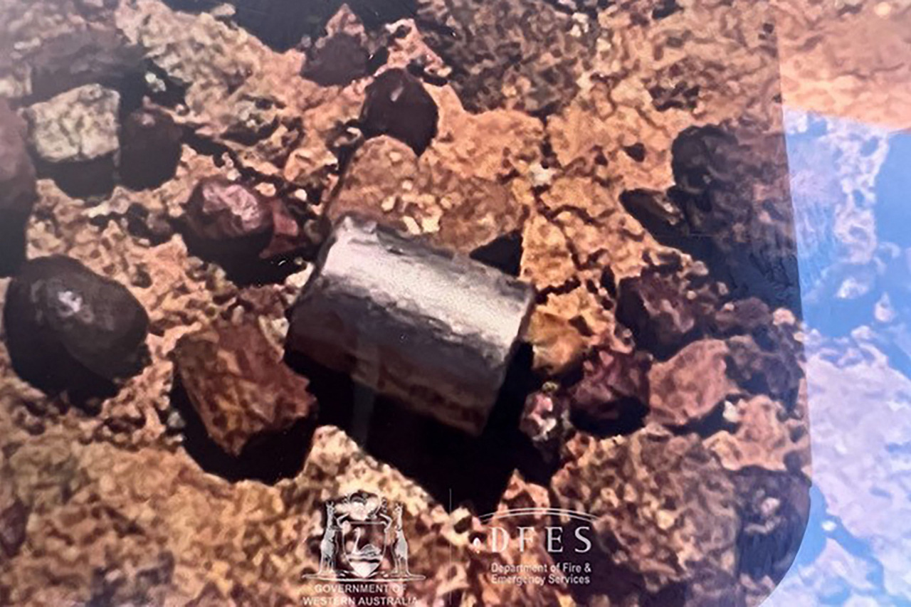 This handout from the Government of Western Australia's Department of Fire and Emergency Services taken and received on February 1, 2023 shows a radioactive capsule, which had fallen off a truck, after it was found along a desert highway south of Newman, Western Australia. - A tiny but dangerously radioactive capsule, which fell off a truck along a remote stretch of Outback highway in Western Australia last month, was found on February 1, authorities said. (Photo by Handout / various sources / AFP) / -----EDITORS NOTE --- RESTRICTED TO EDITORIAL USE - MANDATORY CREDIT