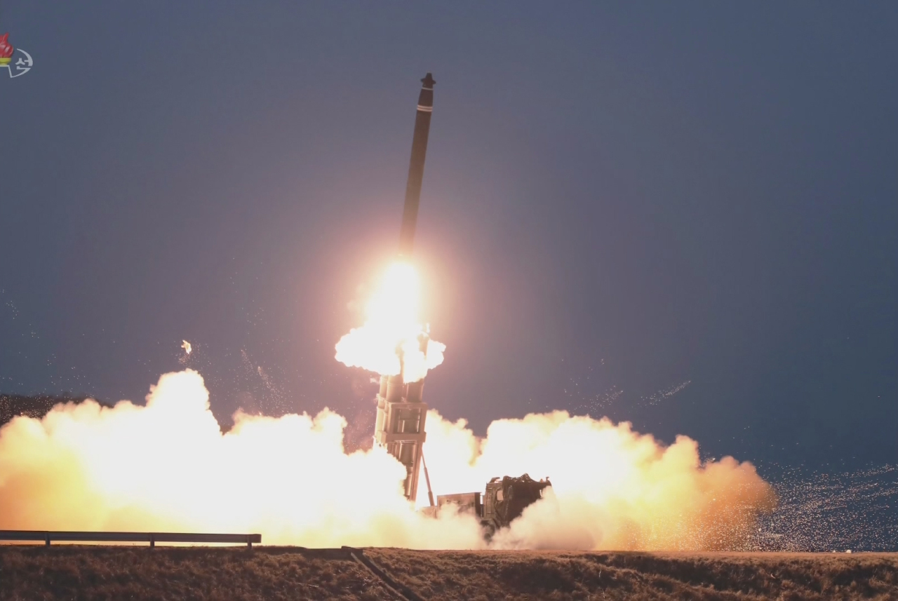 A short-range ballistic missile is launched toward the East Sea from the Sukchon area in South Pyongan Province on Feb. 20, 2023, in this photo captured from North Korea's official Korean Central Television. The artillery unit of the Korean People's Army fired two shots from the 600-mm multiple rocket launcher during firing drills, and they flew 395 km and 337 km, respectively, according to the North's official Korean Central News Agency. (Yonhap)
