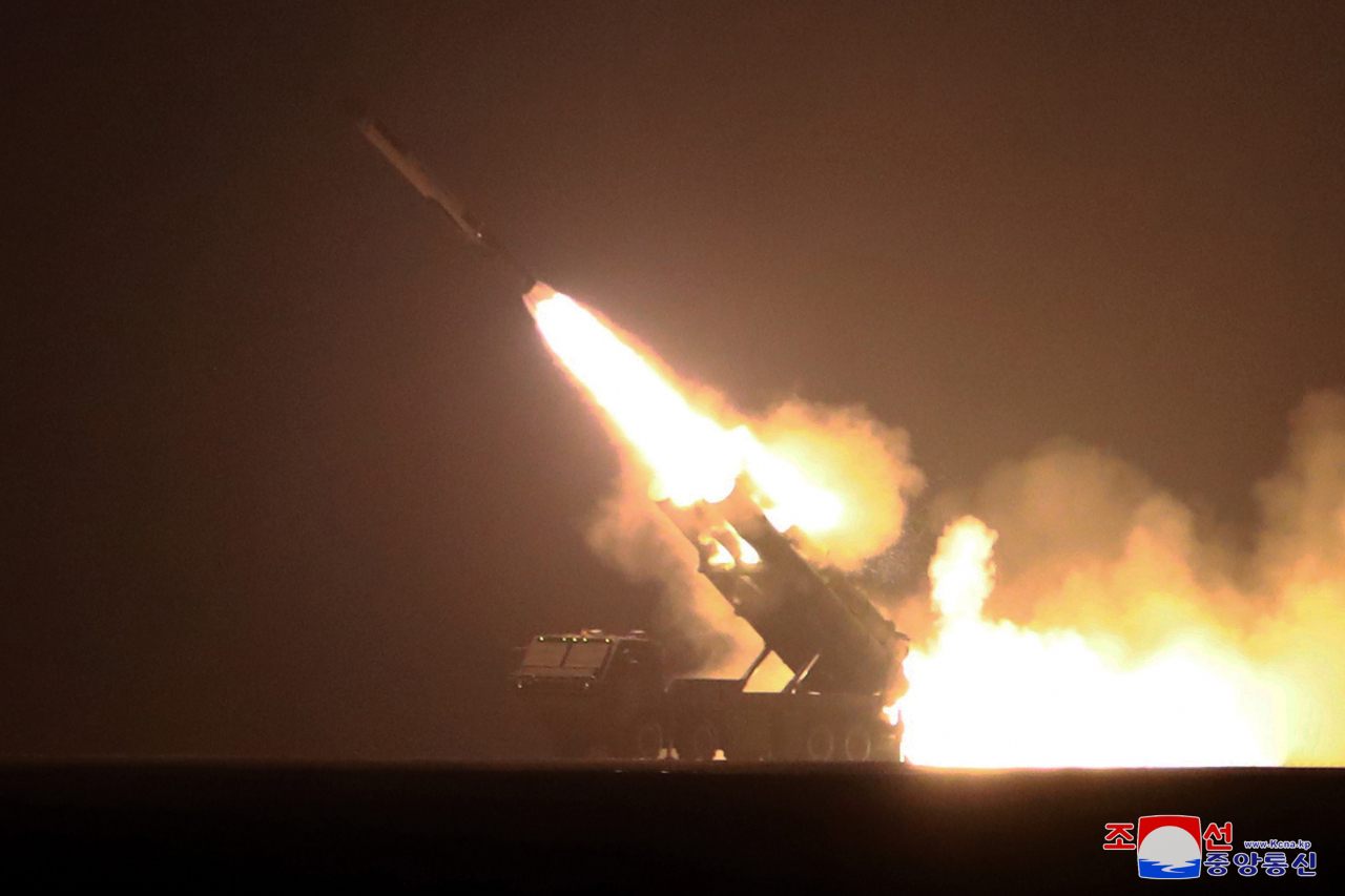 North Korea fires off a cruise missile into the East Sea on Thursday in this photo released by the Korean Central News Agency on Friday. (KCNA-Yonhap)