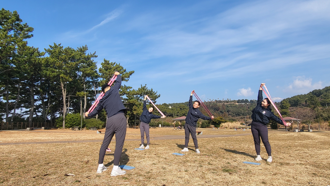 Staff at the JW Marriott Jeju Resort & Spa demonstrate the hotel's outdoor wellness program (Kim Hae-yeon/ The Korea Herald)