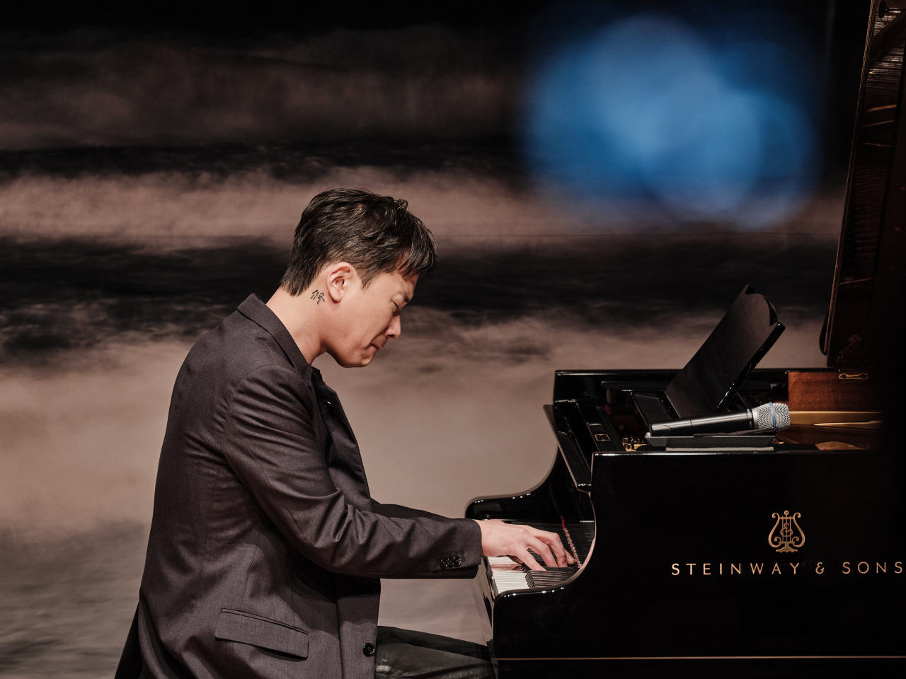 Composer and music director Jung Jae-il performs “Listen” from his latest same-titled album released by Decca Records on Feb. 24 at JCC Art Center, in Seoul. (Universal Music Korea)