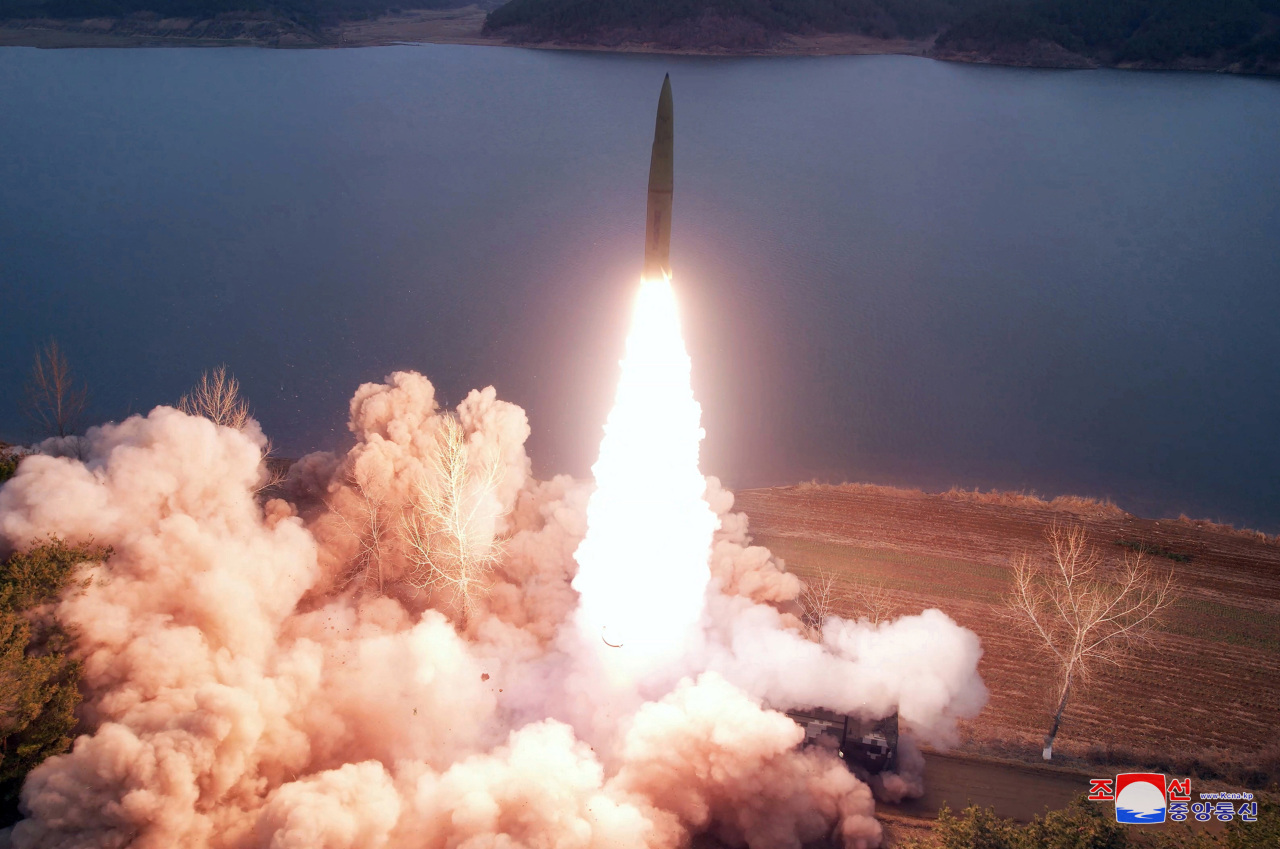 A ballistic missile is launched toward the East Sea from the Jangyon area in South Hwanghae Province on March 14, 2023, in this photo released by North Korea's official Korean Central News Agency the following day. In a demonstration firing drill for sub-military units, a missile unit of the Korean People's Army fired two ground-to-ground missiles in a medium-range system, and they precisely hit their target, Phi Islet, in the waters off Chongjin on the northeastern coast, the KCNA said. (Yonhap)